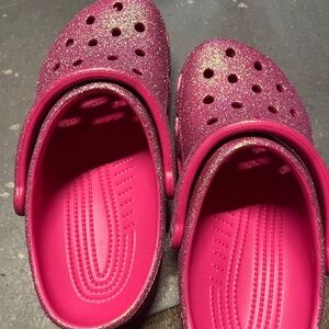 2 pairs of crocs